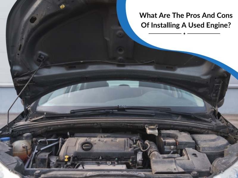 A close-up of a car engine bay, posing the question about the pros and cons of installing used engines.